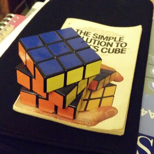 Original Rubik's cube from circa nineteen-eighty, with a nineteen-eighty-one solving guide